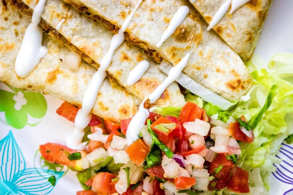 A fresh quesadilla from Amono’s Mexican Kitchen, just minutes away from the spot for u-pick berries in summertime! Photo source.