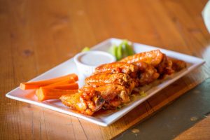 The sweet and savory honey hot wings at Ballard Loft