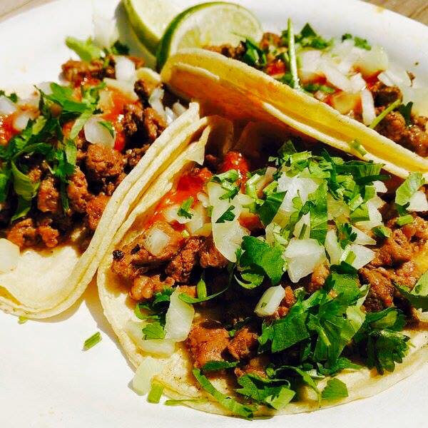 Yummy soft tacos from the Taqueria Los Chilangos food truck. Photo source. 