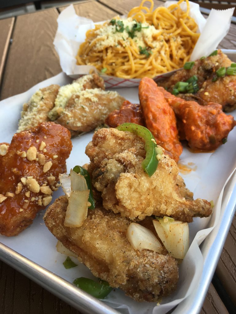 Variety of wings and garlic noodles from Fire Wings